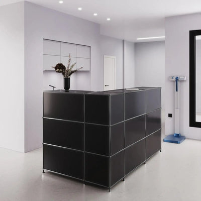 Compact reception desk in chrome black
